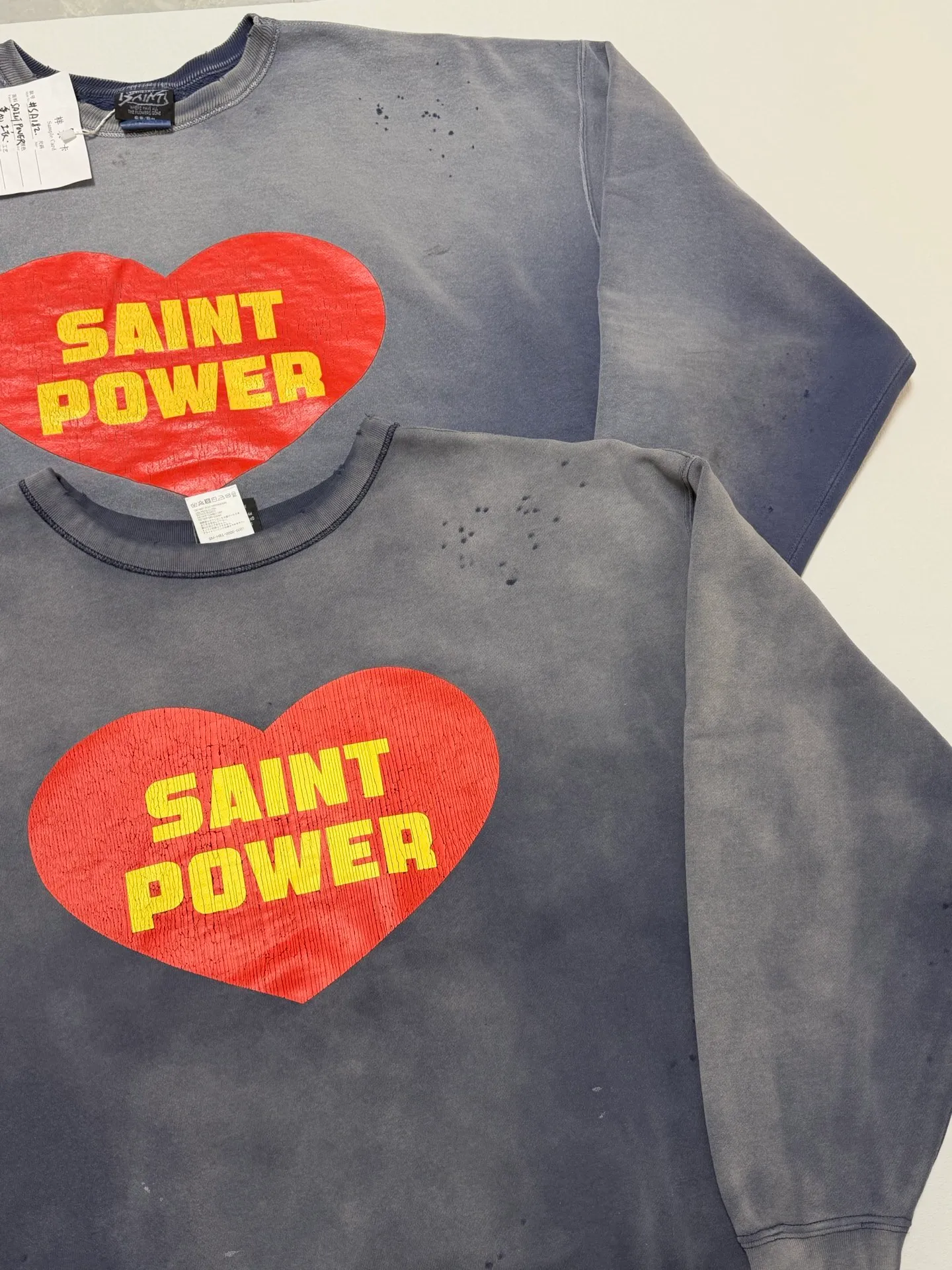 Prenatal printing SAINT Mxxxxxx CRW NECK SWT/SAINT POWER/NVY Love SAINT POWER faded sweatshirt Faded blue S-XL Assute dye Heavy horse, rewashed to make it old and damaged Faded Vintage style Authentic price printing process Rewashed water printing to make old cracks treatment Original loose tailoring Fabric custom woven and dyed Correct main label/wash water label/cherub label